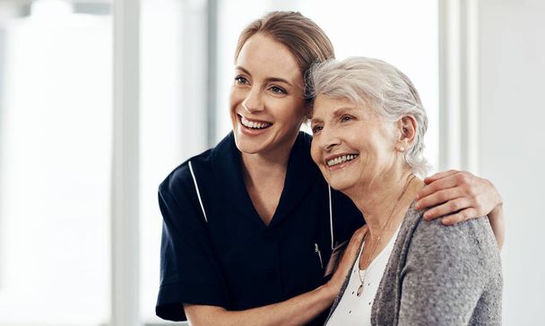 Shes more than just another patient. a female nurse caring for a senior woman - Foto, Imagen