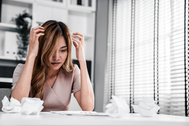 A competent female employee who has become completely exhausted as a result of overburdened work. Concept of unhealthy life as an office worker, office syndrome. - Foto, afbeelding