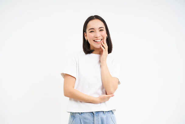 Happy young modern girl, laughing and smiling, posing isolated on white background. - Fotoğraf, Görsel