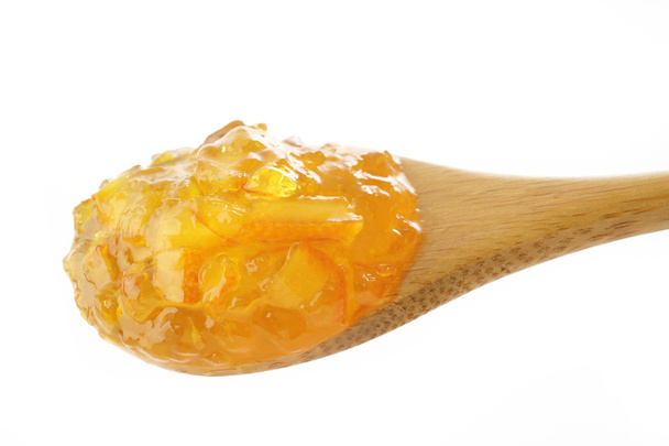 Homemade orange Jam in wooden spoon - Fotoğraf, Görsel