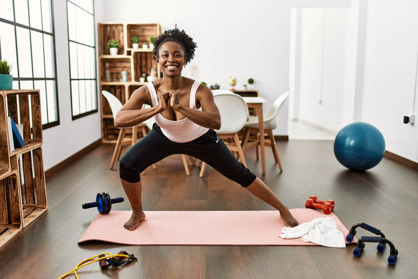African american woman smiling confident training yoga at home - Photo, Image