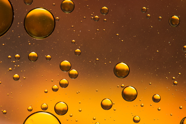Λάδι και το νερό αφηρημένα σε πορτοκαλί και χρυσό - Φωτογραφία, εικόνα