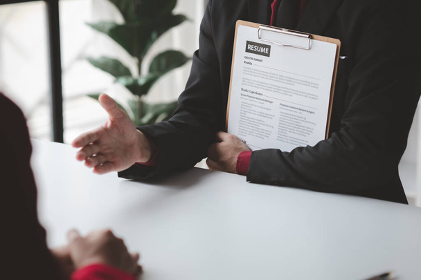 Person submitting resume to interview for a job with a company, Person attending a job interview with a manager to be recruited to the company for the position applied for. Job application concept. - Foto, Bild