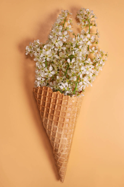 Ice cream waffle cone with flowers - Fotoğraf, Görsel