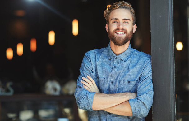 Portrait, happy and man in a cafe, arms crossed and startup success with employment, business owner or joyful. Face, male employee or confident entrepreneur with a smile, coffee shop and professional. - Foto, Imagem