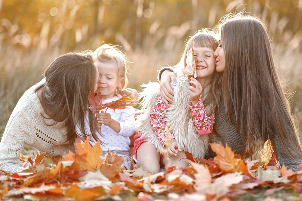 portrait of a beautiful family in autumn - 写真・画像