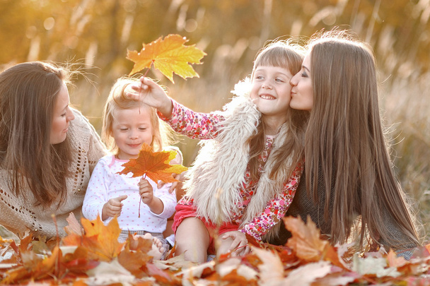 portrait of a beautiful family in autumn - 写真・画像