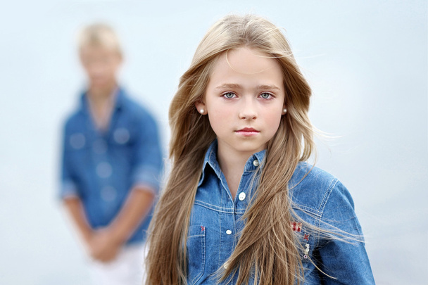 Portrait of a boy and girl on the beach in summer - Photo, Image