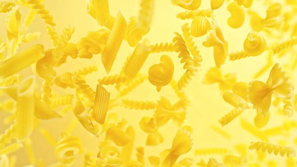 Dry pasta mix flying in the air. Freeze motion of italian food, close-up background. - 写真・画像