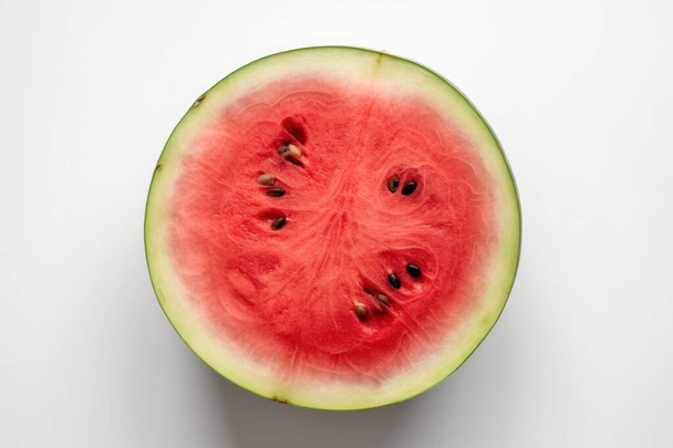 Watermelon on a white isolated background, Fresh tasty fruit. High-quality photo - Фото, изображение