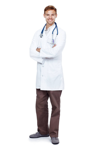 Your good health is his priority. Full length studio portrait of a young male doctor isolated on white - Фото, зображення