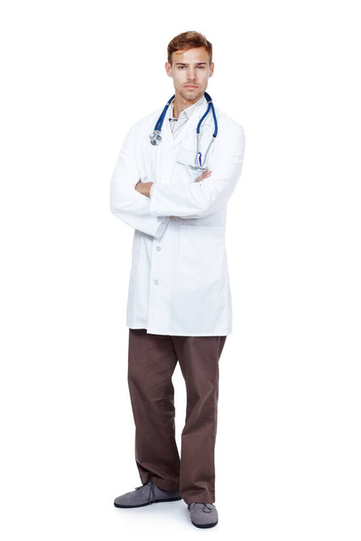 He gives his patients the best care possible. Full length studio portrait of a young male doctor isolated on white - Foto, Imagen
