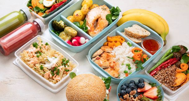 Healthy meal slimming diet plan daily ready menu background, organic fresh dishes and smoothie, fork knife on paper eco bag as food delivery courier service at home in office concept, top view. Panorama. - Photo, image