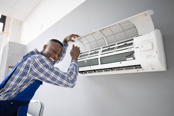 AC Electrician Technician Repairing Air Conditioner Appliance - Photo, Image