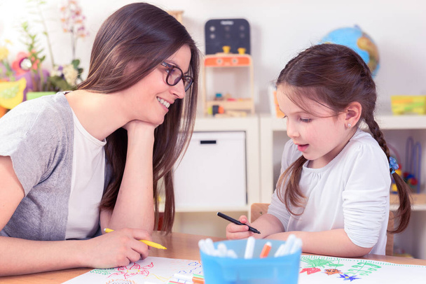 Teacher and Cute Little Girl Drawing Lessons Art Class - Photo, Image