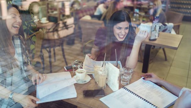 smiling student girls talking in coffee shop after classes - Fotografie, Obrázek