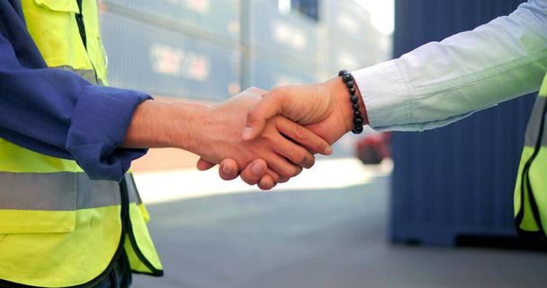 Handshake in construction site industrial worker on factory warehouse background after successful dealing, teamwork, collaboration - Foto, afbeelding