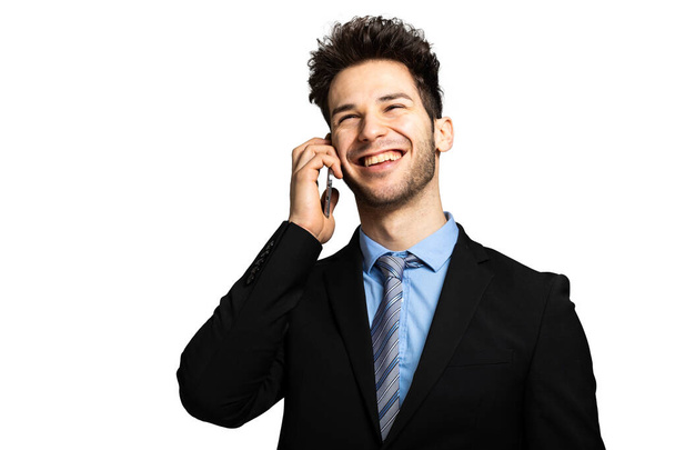 Smiling businessman talking at the phone isolated on white - Valokuva, kuva