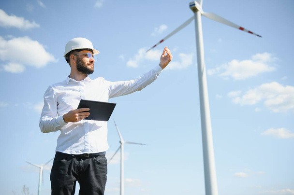 Power engineer are working with wind turbines - Photo, image