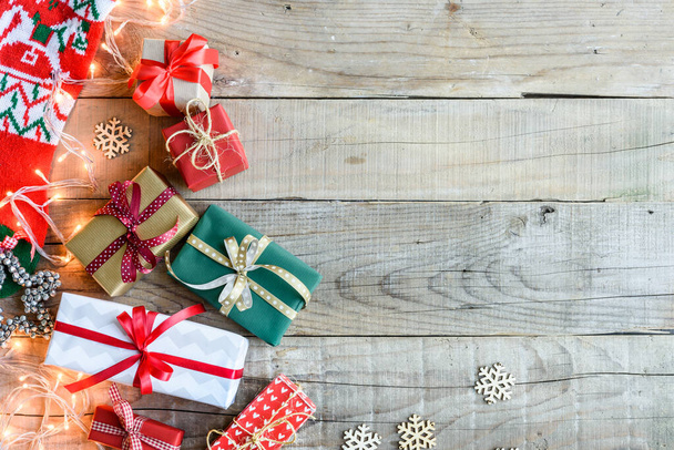 top view on christmas gifts on wooden background - Photo, Image