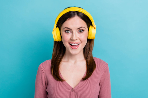 Portrait of impressed woman stylish hairstyle wear trendy shirt headphones listen excited playlist isolated on teal color background. - Fotó, kép
