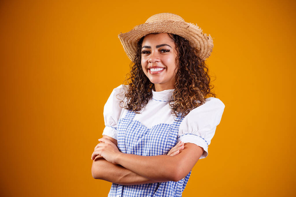 Brazilian woman wearing typical clothes for the Festa Junina with cross arms - Photo, image