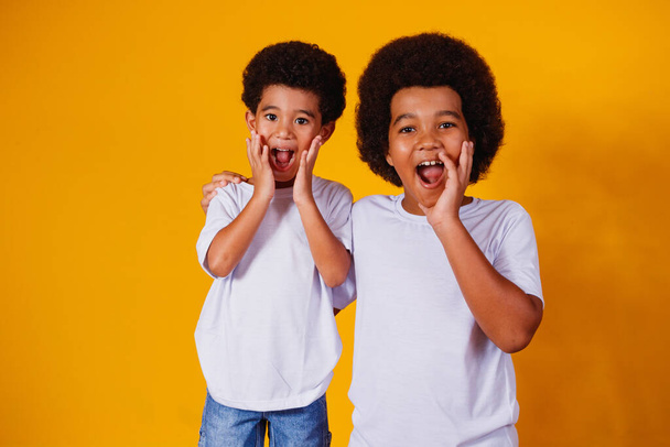 afro brothers on yellow background. brother's day - Photo, image