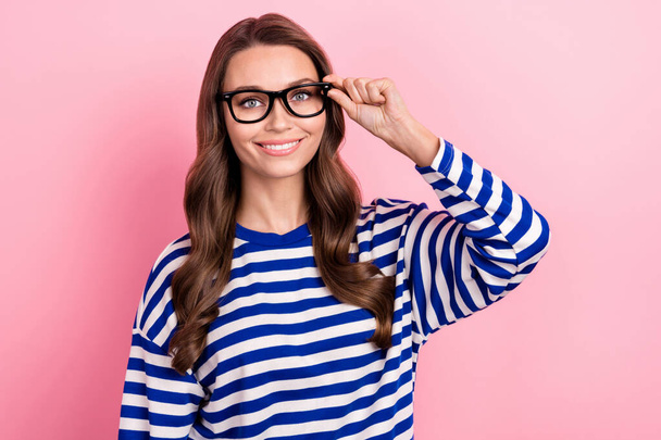 Photo of young business lady wear striped blue shirt touch eyeglasses experienced financial topic isolated on pink color background. - Φωτογραφία, εικόνα