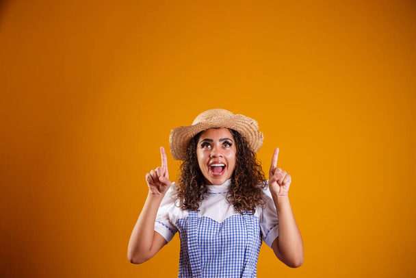 Brazilian woman wearing typical clothes for the Festa Junina with cross arms - Foto, Imagen