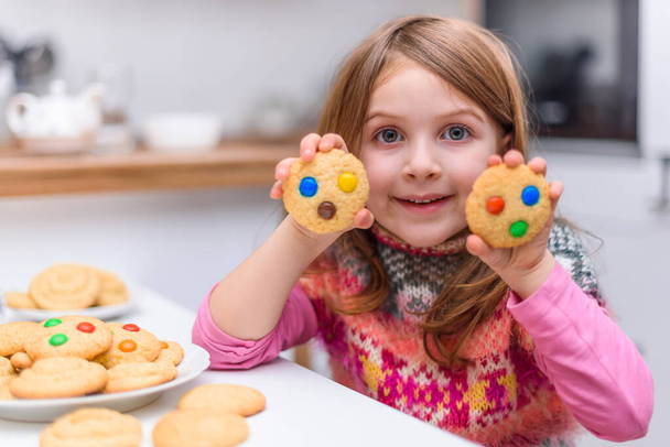 smiling little girl with cookies  - Photo, Image