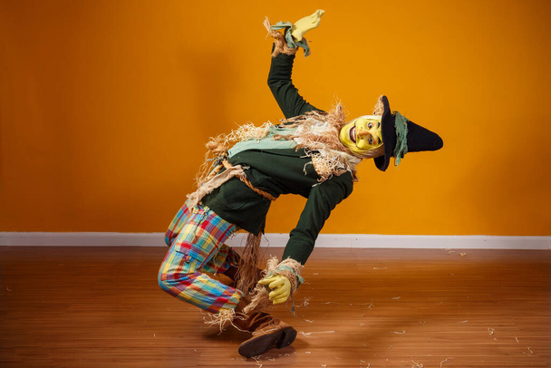 photo of scarecrow character from festa junina on yellow background with space for text - Valokuva, kuva