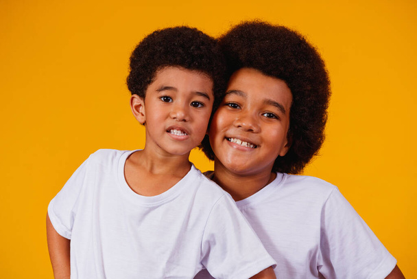 afro brothers on yellow background. brother's day - Fotó, kép