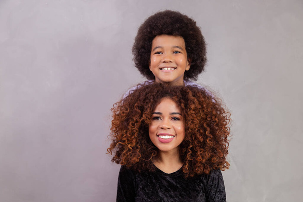 Mother and son with black power style hair. - Photo, Image