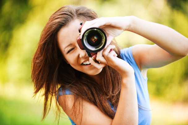Young smiling girl making photo - Photo, Image