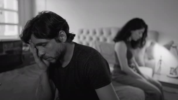 Desperate couple going through difficult times. Unhappy relationship breakdown. People suffering from a bad marriage in dramatic monochromatic black and white - Footage, Video
