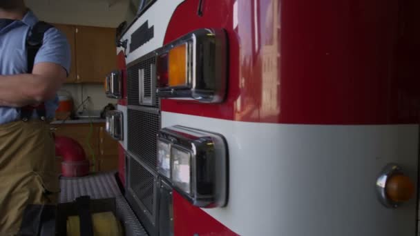 Portrait of a firefighter near truck - Materiał filmowy, wideo