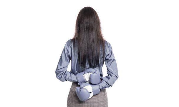 back view of businesswoman rivalry in studio. businesswoman rivalry on background. photo of businesswoman rivalry wear boxing gloves. businesswoman rivalry isolated on white. - Foto, afbeelding