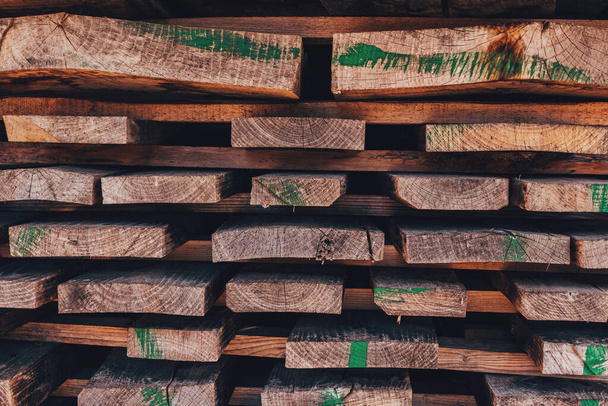 Stack of wooden planks solid-sawn timber construction material as background - Φωτογραφία, εικόνα