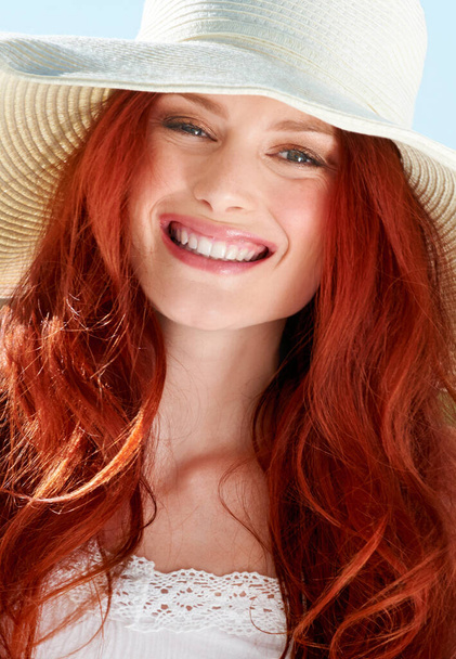 Happy woman, portrait and face with straw hat for summer vacation, confident style and sunny holiday. Female person, red hair and smile with fashion accessory, freedom and happiness to relax outdoor. - Foto, Bild
