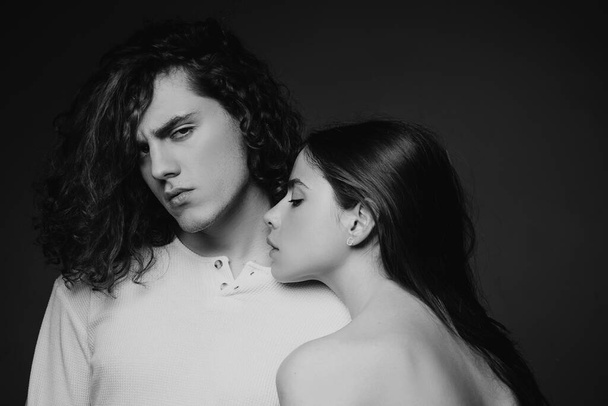 Sensual portrait of young couple in love. Loving couple embracing and kissing - 写真・画像