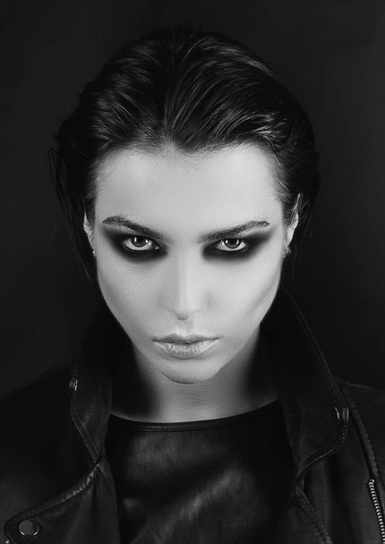 Young woman with black make up in black studio. Fashion portrait. Fashion portrait of glamour sensual young stylish lady - Fotografie, Obrázek
