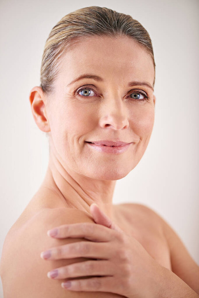 Shes nurtured her skin through the years. Cropped portrait of an attractive mature woman posing in studio - Photo, Image