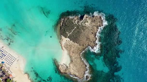 Aerial view of beautiful Nissi beach in Ayia Napa, Cyprus. Nissi beach in Ayia Napa famous tourist beach in Cyprus. A view of a azzure water and Nissi beach in Aiya Napa, Cyprus. - Footage, Video