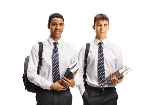 Male students in school uniforms holding books isolated on white background - Fotografie, Obrázek