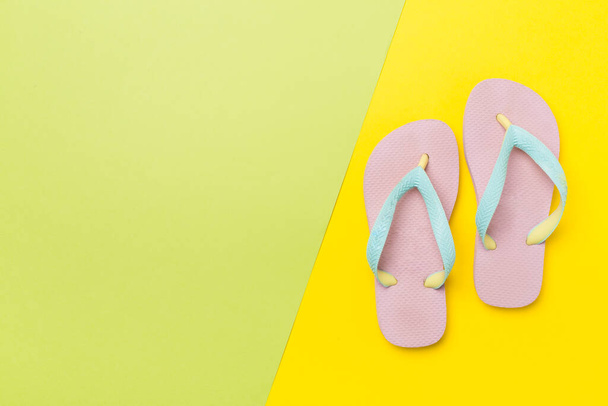 Bright flip flops on color background, top view - Photo, Image