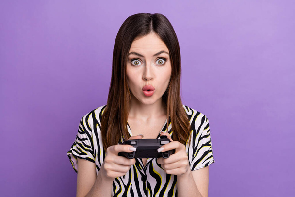Photo of young crazy girl wear zebra print shirt hold gamepad playstation console pouted lips hard game isolated on violet color background. - Φωτογραφία, εικόνα