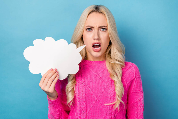 Photo of angry dissatisfied girl with wavy hairdo dressed pink sweater hold dialog cloud shouting isolated on blue color background. - Фото, зображення