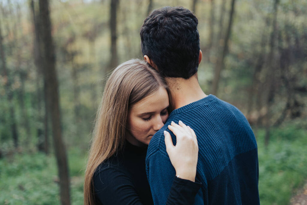 Young couple hugging in a forest - Foto, Imagen