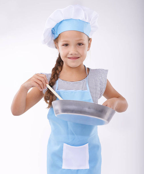 Learning how to cook. Portrait of a young girl holding cooking utensils - Photo, Image