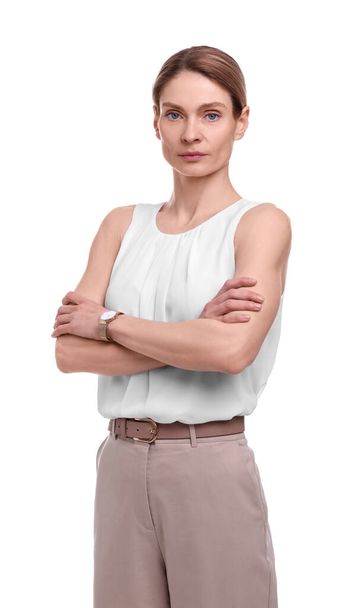 Beautiful businesswoman crossing arms on white background - Фото, изображение